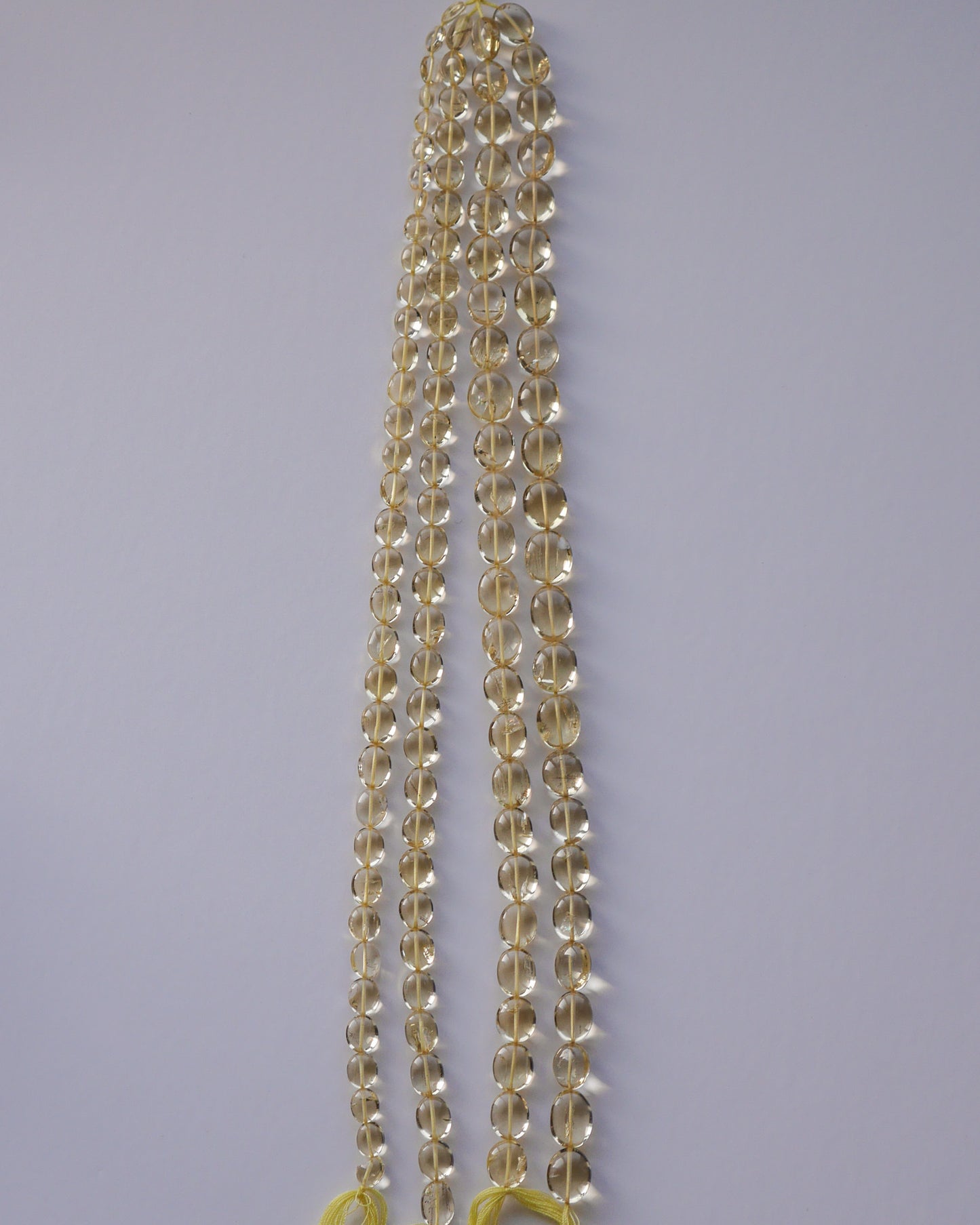 宝石質 スキャポライト スムースオーバル ライトイエロー 1連