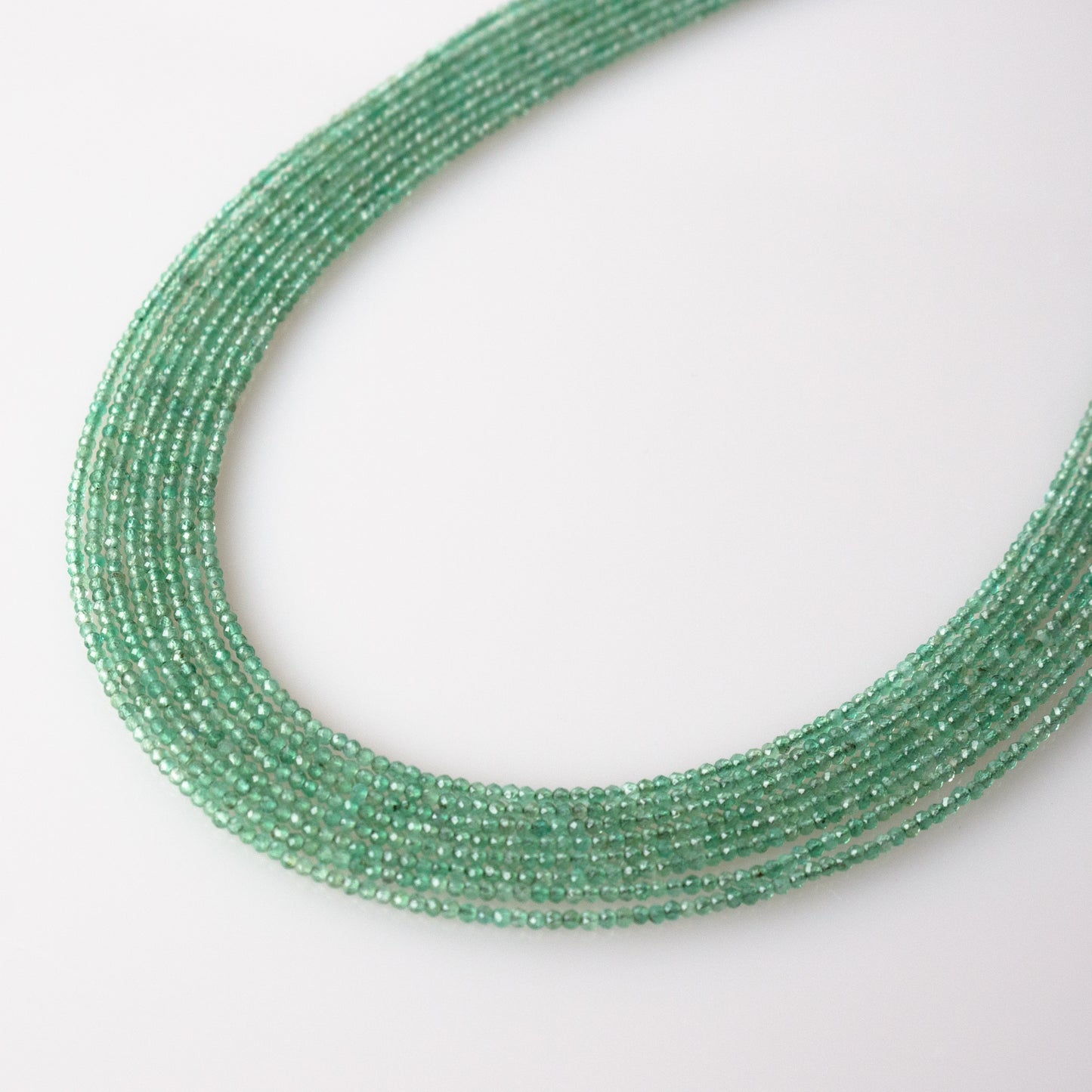 Emerald Faceted Semi-Round Beads 1Strand
