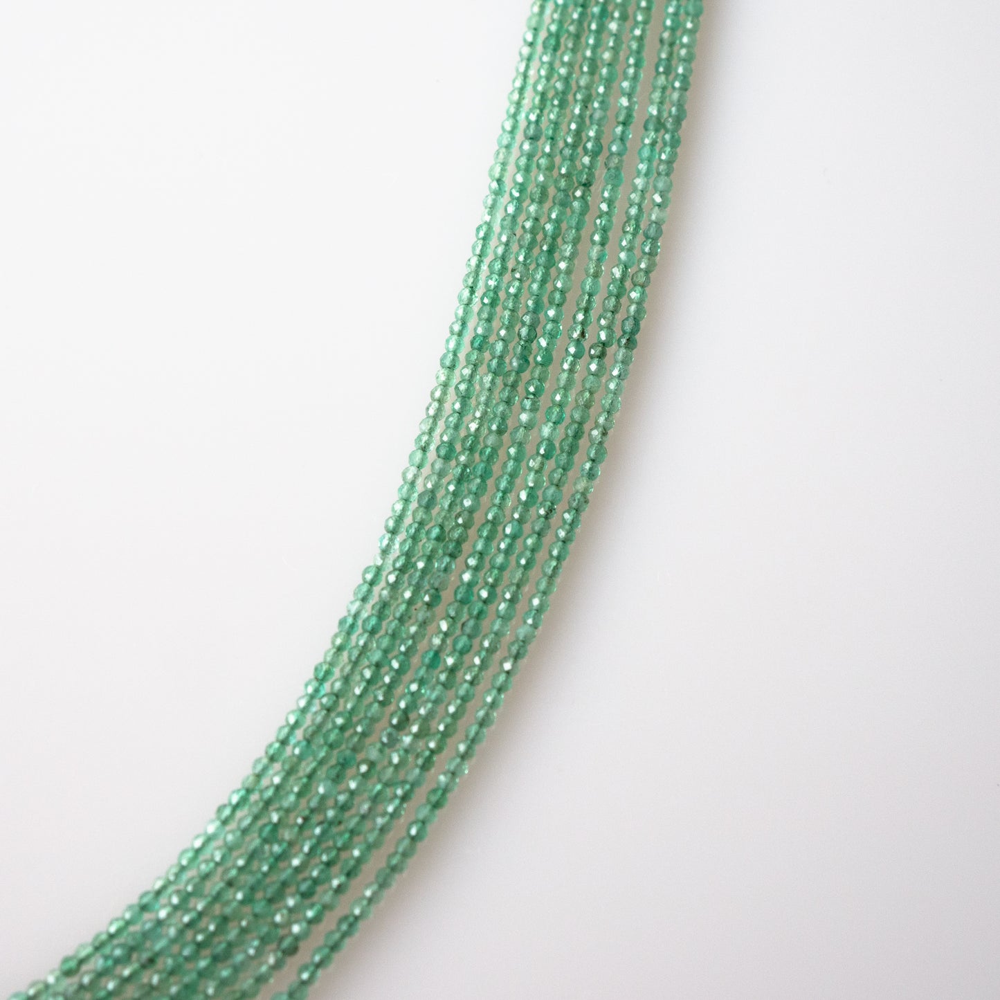 Emerald Faceted Semi-Round Beads 1Strand