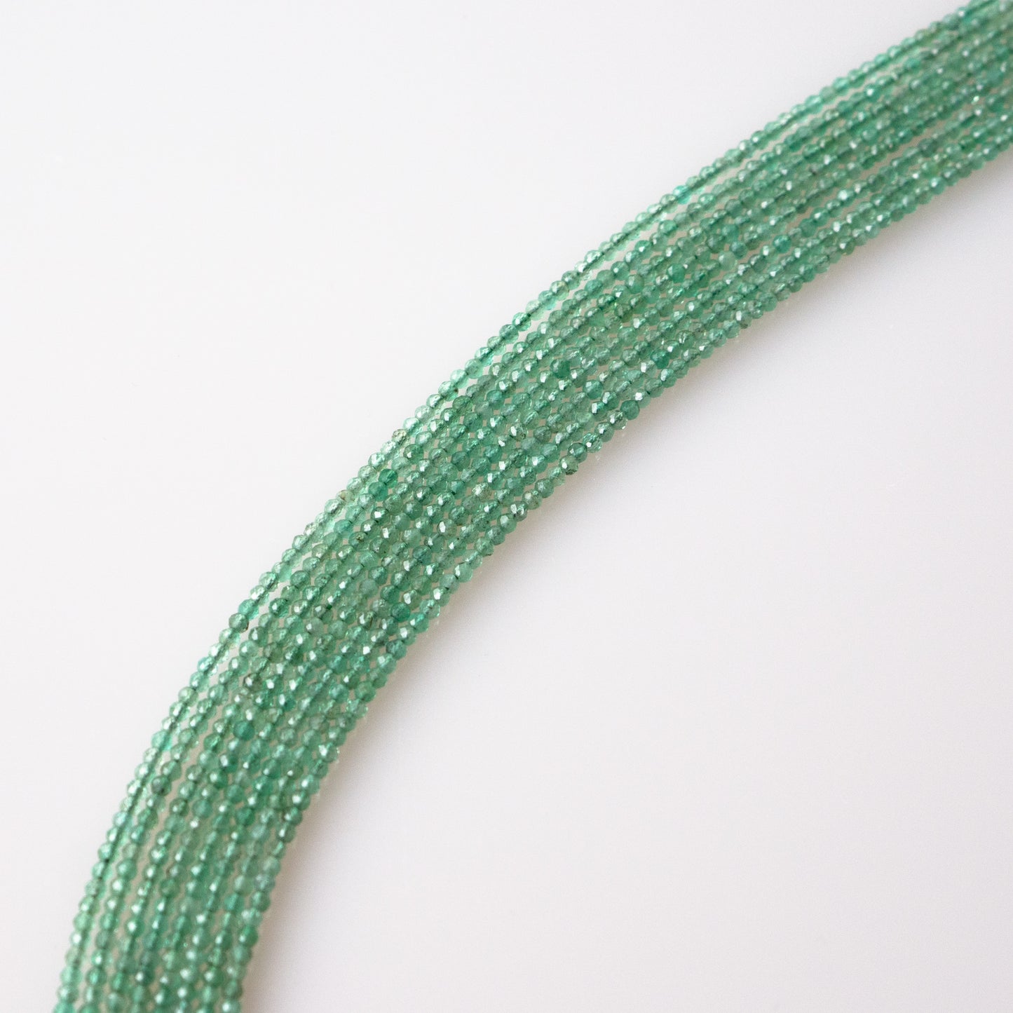 Emerald Faceted Semi-Round Beads 1Strand