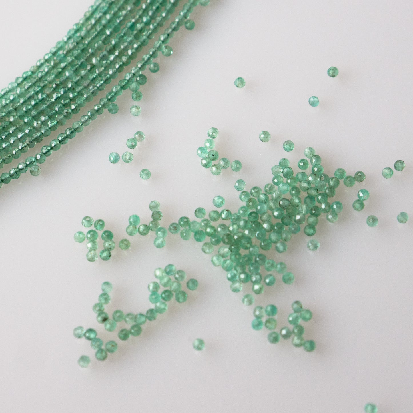 Emerald Faceted Semi-Round Beads 1Strand