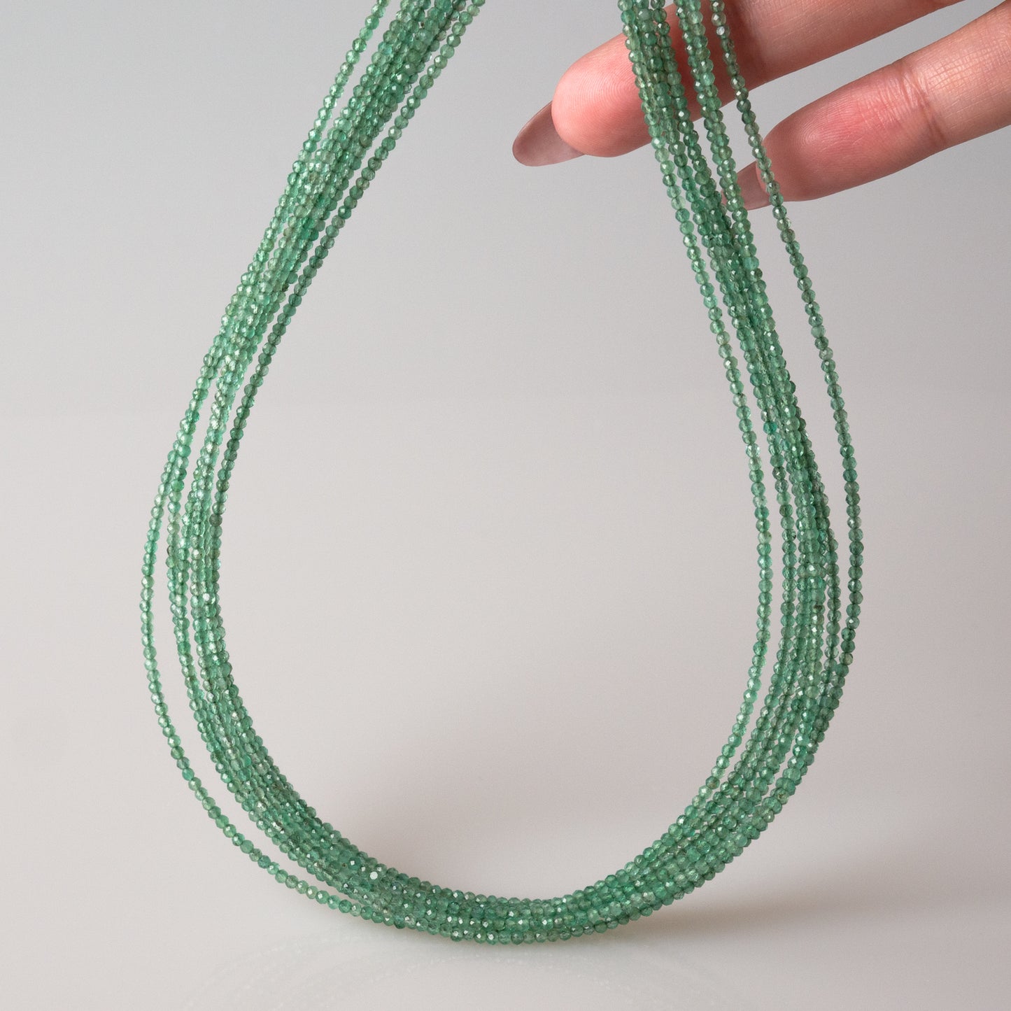 Emerald Faceted Semi-Round Beads 1Strand