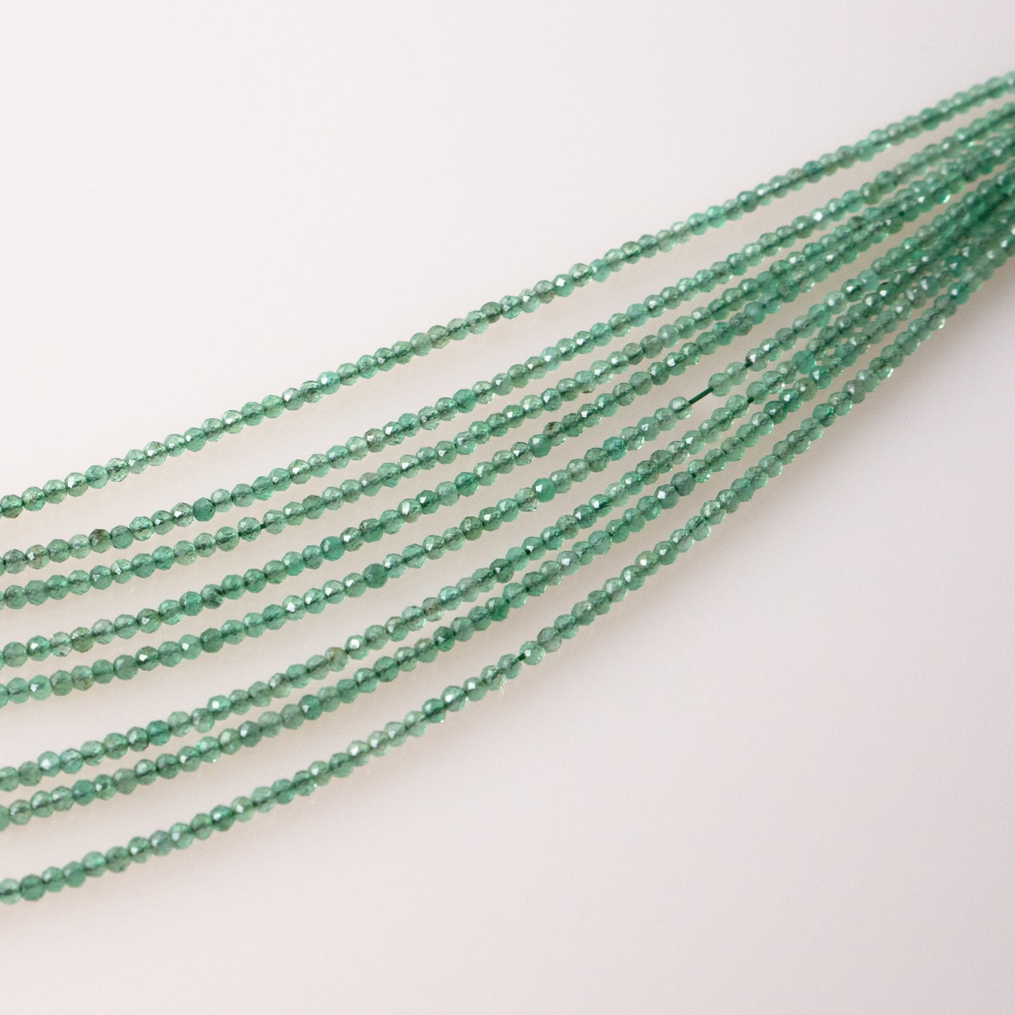 Emerald Faceted Semi-Round Beads 1Strand
